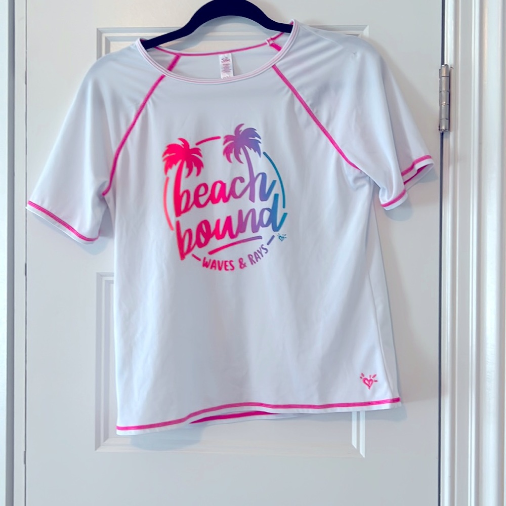 Justice Girls swim rash guard. New without tag. Size 14/16. Excellent condition.
